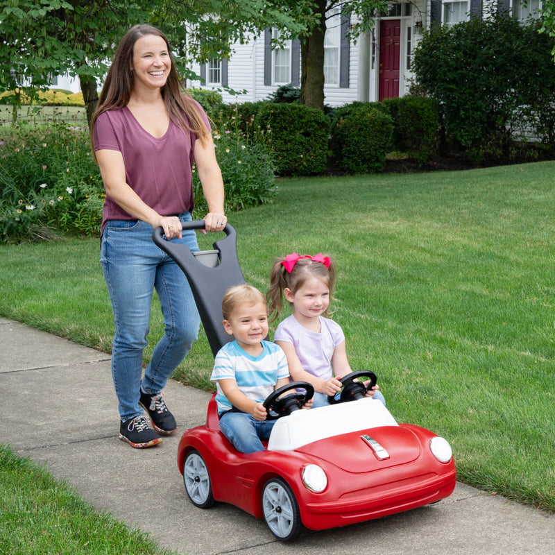 Side-By-Side Push Around Roadster™ with kids riding