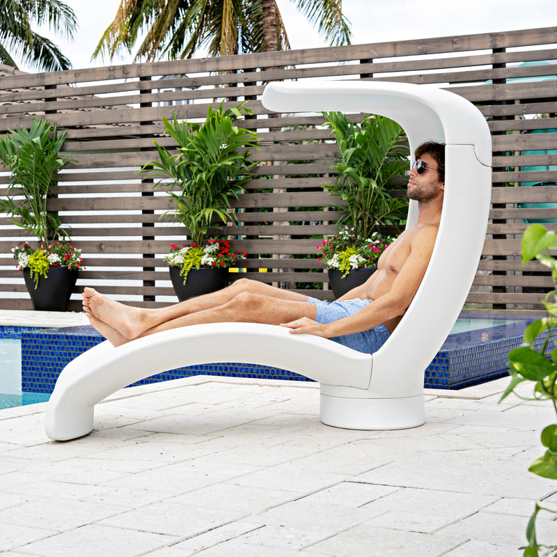 Mondello Lounger with Shade lounging next to pool